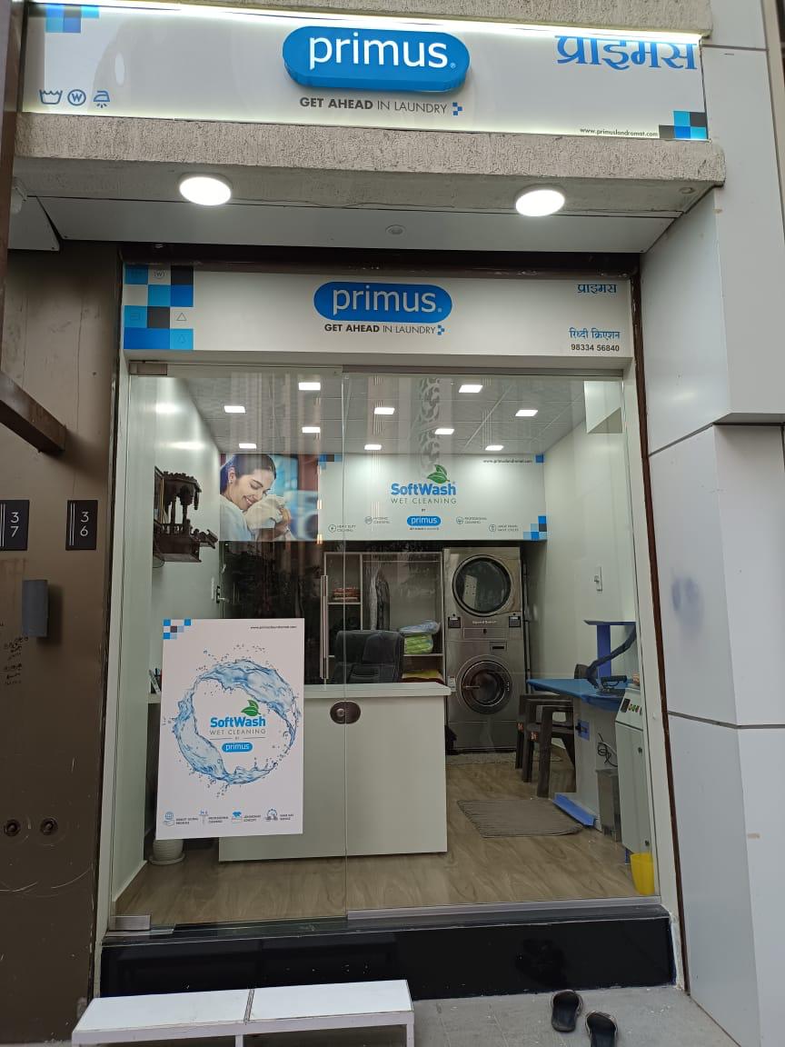 Front view of Primus Laundromat store in Jodhpur with clear signage and customers.