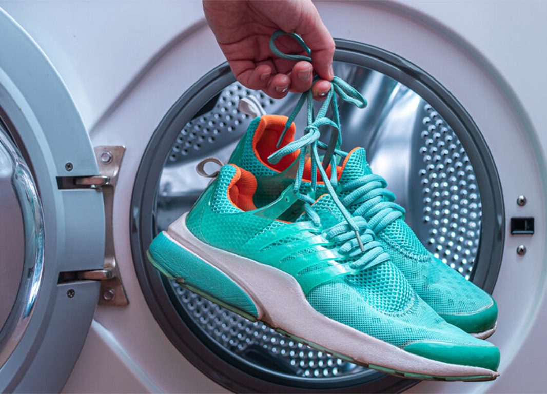 Close up of shoes being cleaned with rich soap lather for deep dirt removal and shine restoration